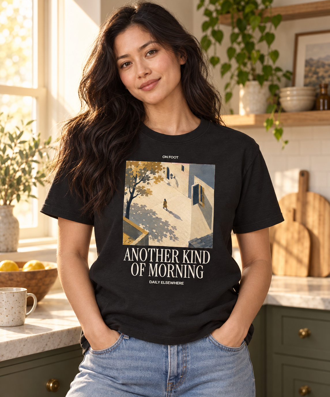 Another Kind Of Morning — Female model wearing a dark T-shirt with light front artwork. Daily Elsewhere.