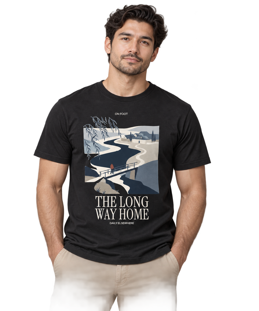 The Long Way Home — Male model wearing a dark T-shirt with light front artwork. Daily Elsewhere.