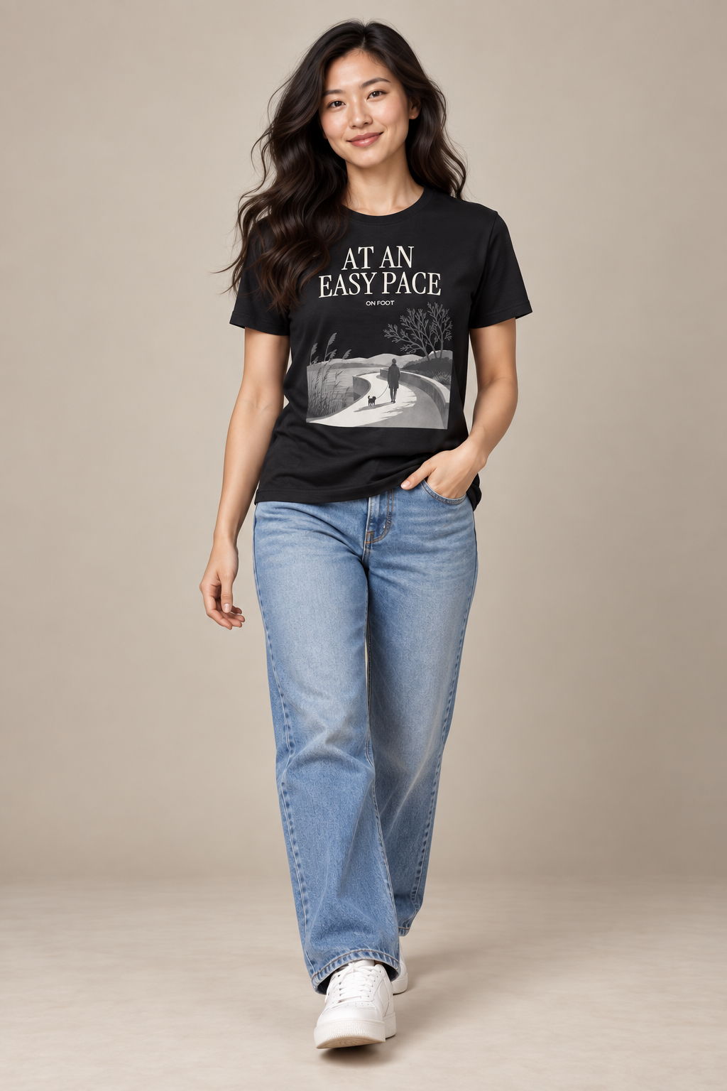 At An Easy Pace — Female model wearing a dark T-shirt with light front artwork. Daily Elsewhere.