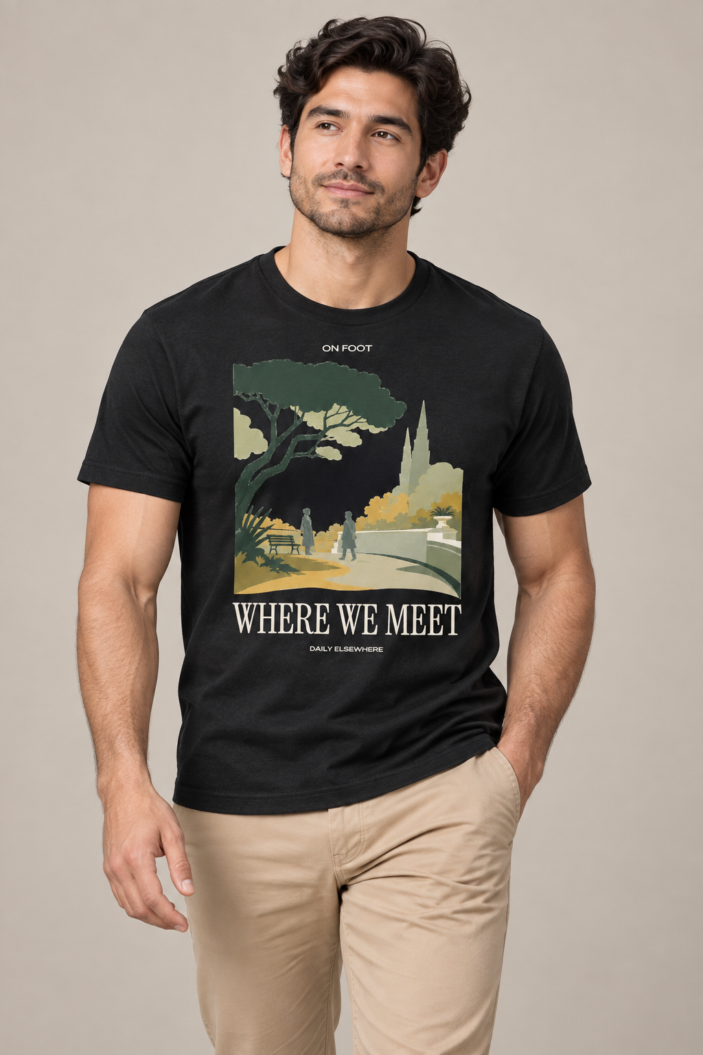 Where We Meet — Male model wearing a dark T-shirt with light front artwork. Daily Elsewhere.