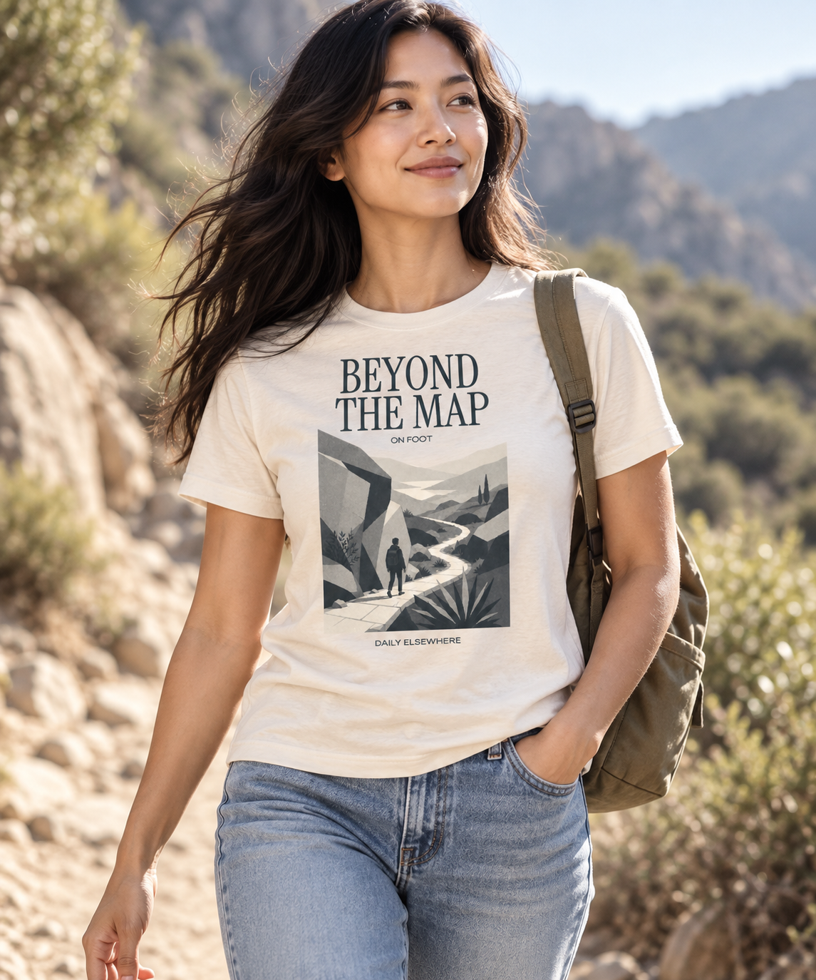 Beyond The Map — Female model wearing a light T-shirt with the front artwork. Daily Elsewhere.