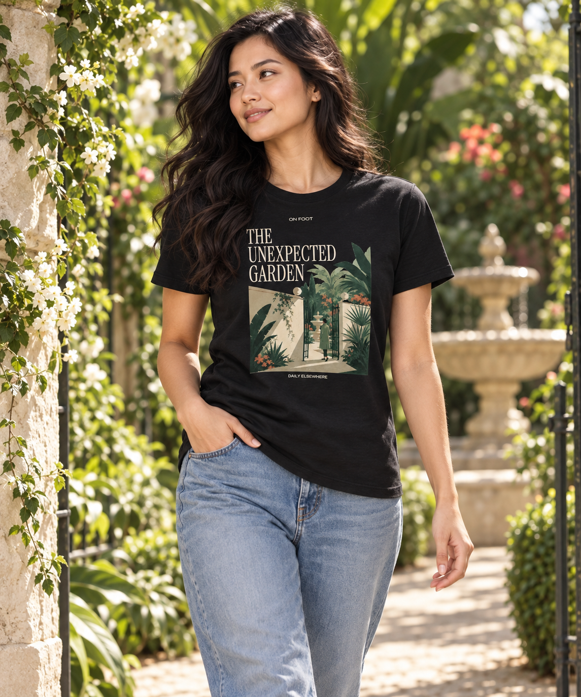 The Unexpected Garden — Male model wearing a dark T-shirt with light front artwork. Daily Elsewhere.