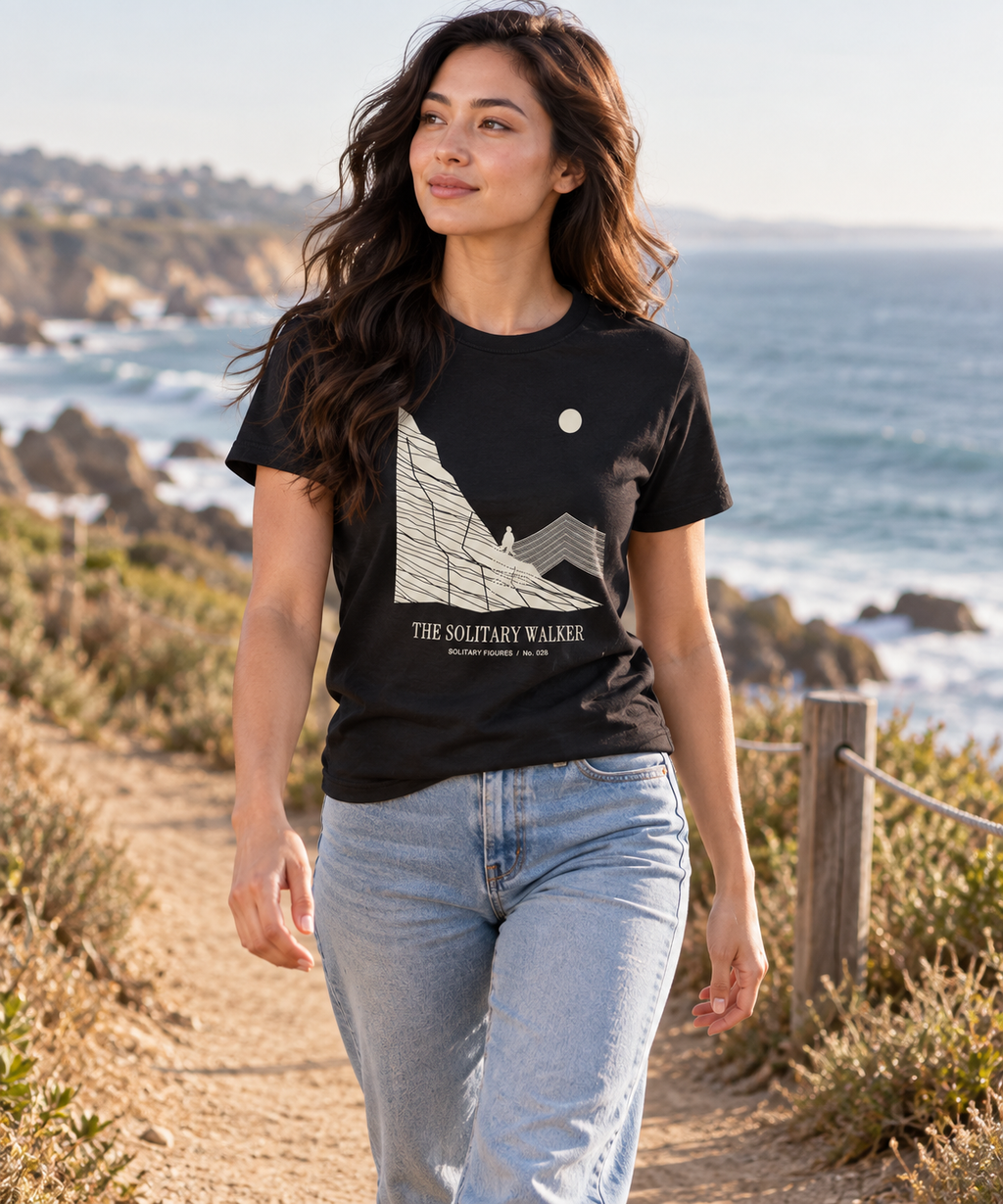The Solitary Walker — Light T-shirt with the front artwork on a contextual background. Daily Elsewhere.