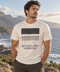 Between Two Horizons — Male model wearing a light T-shirt with the front artwork. Daily Elsewhere.