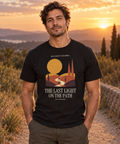 The Last Light on the Path — Male model wearing a dark T-shirt with light front artwork. Daily Elsewhere.