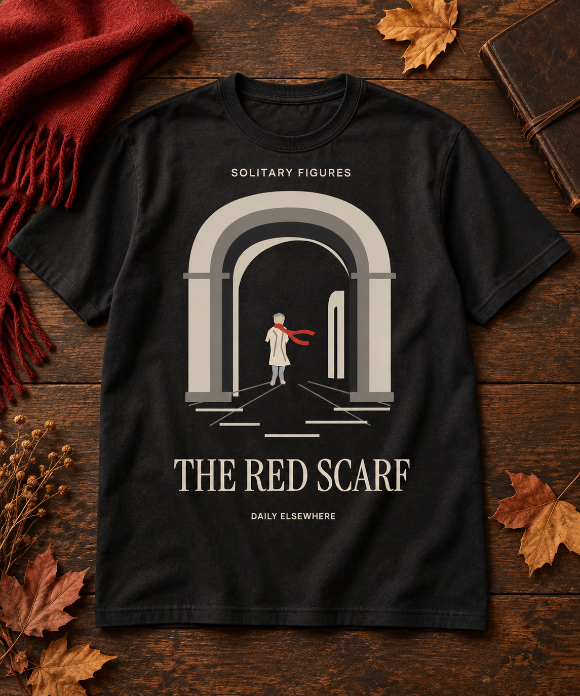 The Red Scarf — Light T-shirt with the front artwork on a contextual background. Daily Elsewhere.