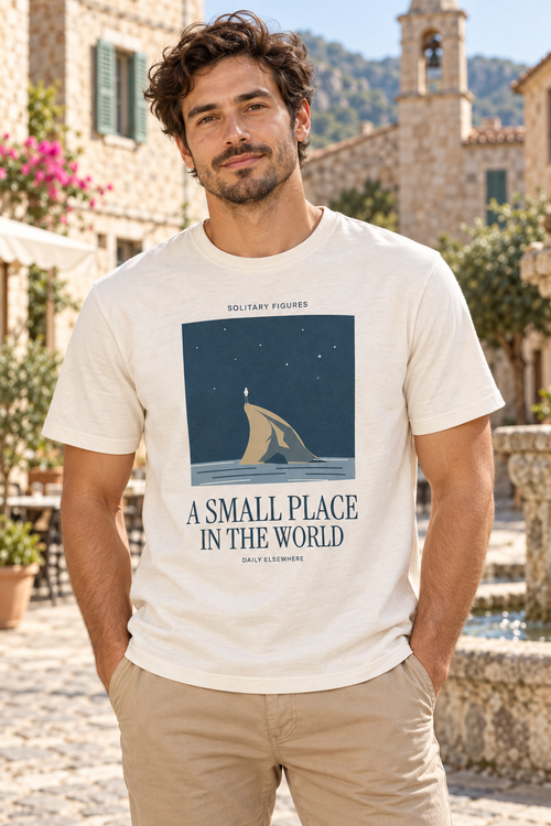 A Small Place in the World — Male model wearing a light T-shirt with the front artwork. Daily Elsewhere.