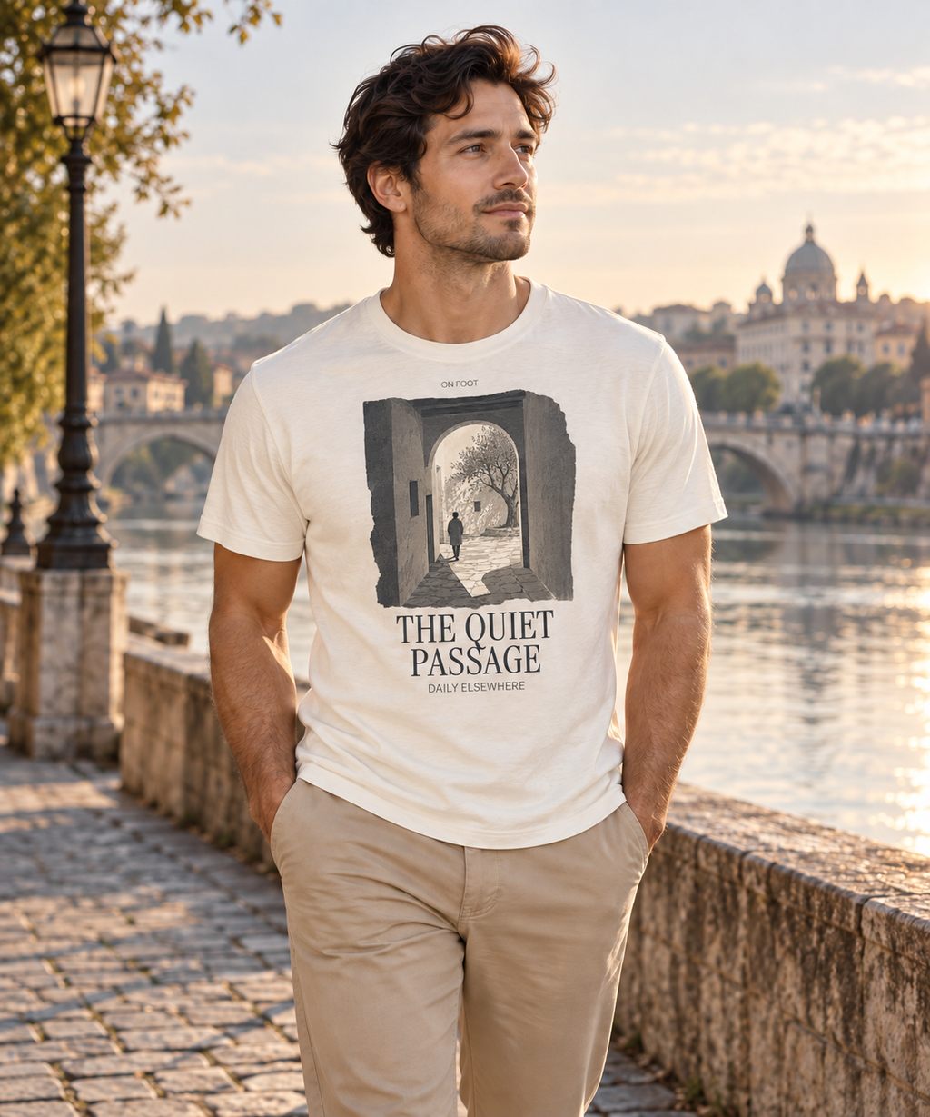 Man wearing a light T-shirt with the The Quiet Passage front print.