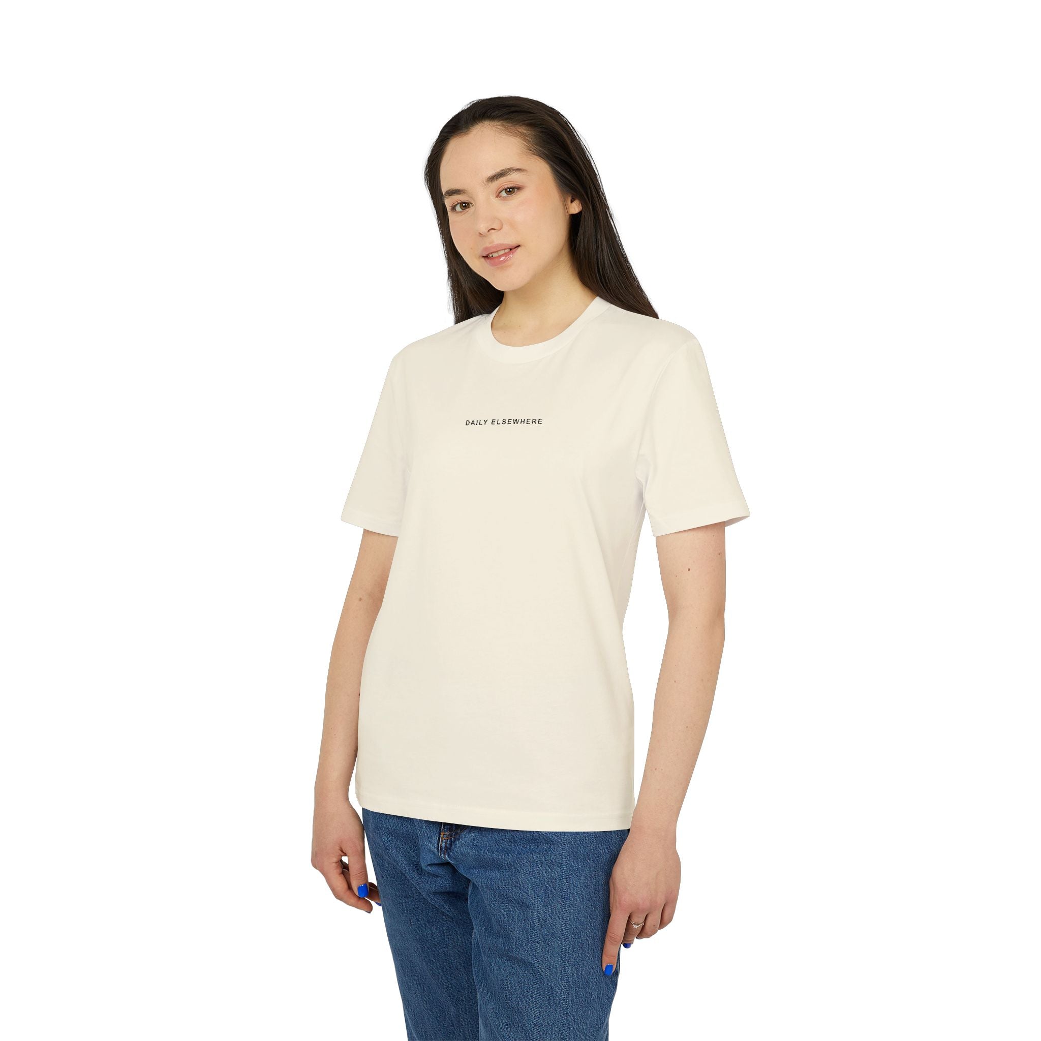 Model wearing the Natural Raw Daily Elsewhere T-shirt, showing the front chest wordmark.